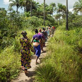 Women walking through forest
